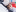 Mutter mit Maske und Baby im Caritas Baby Hospital